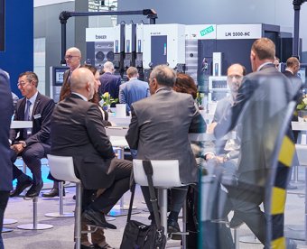 Exhibitors and visitors meet on a stand at EuroBLECH